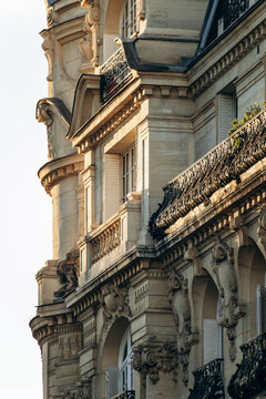 Ornate Haussmann-style residential building with wrought-iron balconies and sculpted limestone facade in the 17th arrondissement in Paris