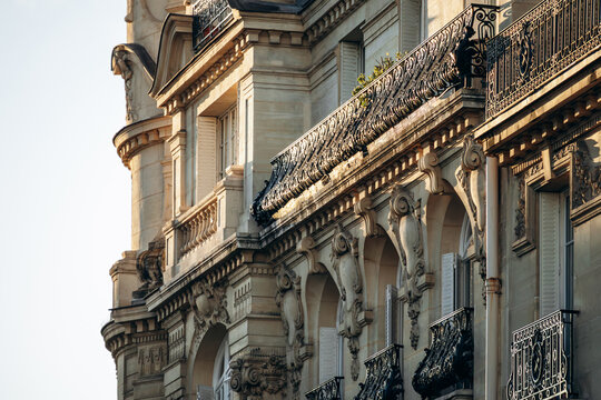 Ornate Haussmann-style residential building with wrought-iron balconies and sculpted limestone facade in the 17th arrondissement in Paris