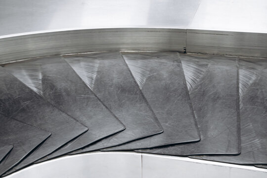 Close-up view of empty baggage conveyor belts in the baggage claim area