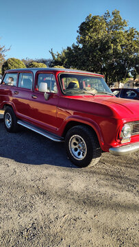 ITABIRA, BRAZIL - JULY 19, 2026: Classic red Chevrolet Veraneio station wagon parked outdoors on a gravel ground