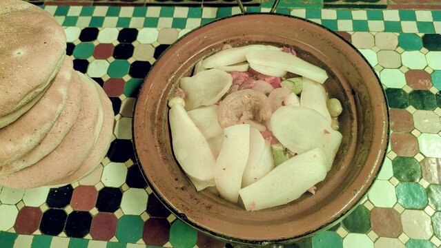 Traditional Moroccan Tagine with Sliced Potatoes and Onions