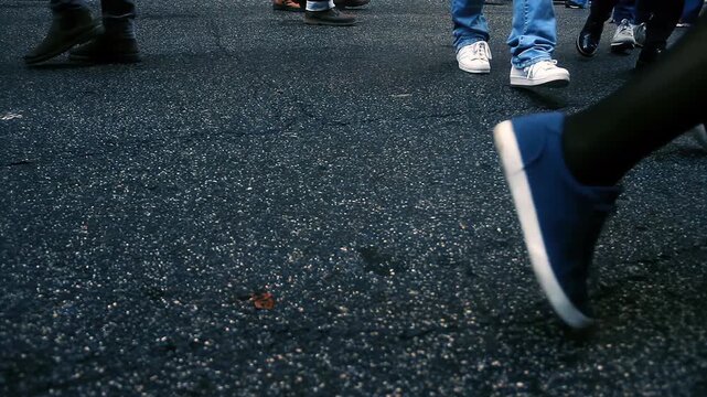 Close Up Ground Level View of People Walking Across City Street - 4K