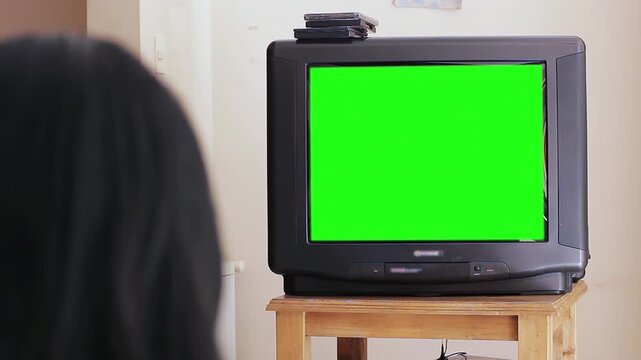 Person Watching Vintage CRT Television with Green Screen Chroma Key - 4K