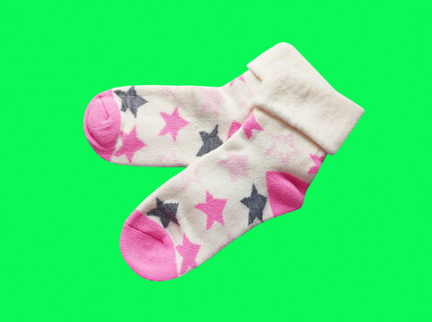 A pair of soft children's socks with a vibrant print. Cozy and warm knitted apparel for toddlers, isolated close-up shot. Concept of comfort, care, and kids' fashion.