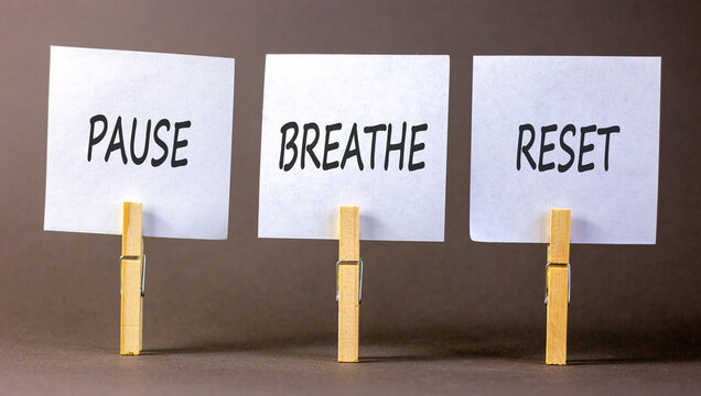 Pause breathe reset words symbol. Concept words Pause breathe reset on beautiful white papers. Beautiful grey background. Business support motivational and pause breathe reset concept. Copy space.
