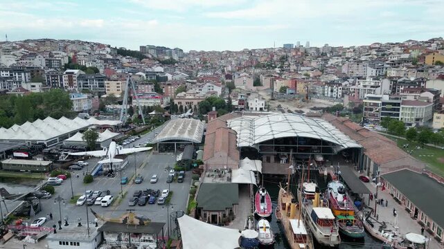 Beyoglu, Istanbul, Turkiye - 14 July 2026: Aerial view of the Rahmi M. Koc Museum featuring historic industrial buildings, vintage aircraft, and boats docked along the Golden Horn.
