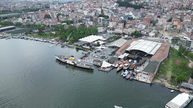 Beyoglu, Istanbul, Turkiye - 14 July 2026: Aerial view of the Rahmi M. Koc Museum on the Golden Horn with historic ships and urban surroundings.