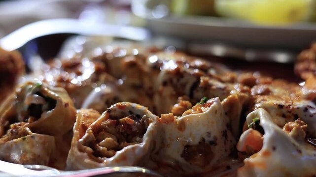 Close-up of traditional Turkish yogurt tantuni with melted butter sauce