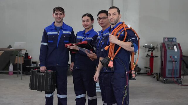 Technician engineer workshop uniform teamwork diagnostic cable toolbox service tablet portrait in automotive garage, maintenance crew with equipment case beside testing machine, ready for repair
