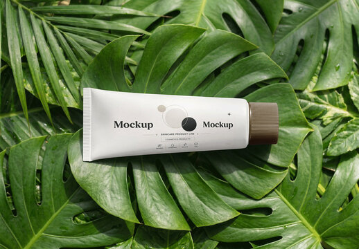 Cosmetic Tube Mockup On Green Tropical Leaves