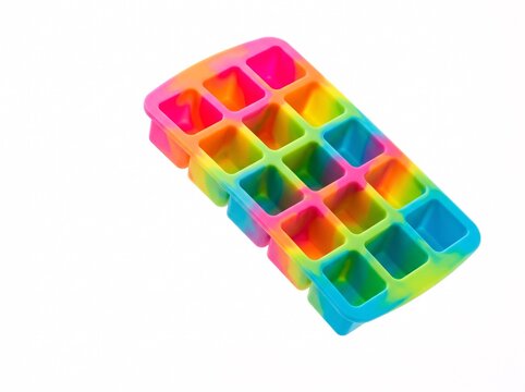 A vibrant, multi-colored silicone ice cube tray with a swirling rainbow tie-dye pattern, isolated on a clean white background for kitchen, bar, and creative beverage preparation concepts.