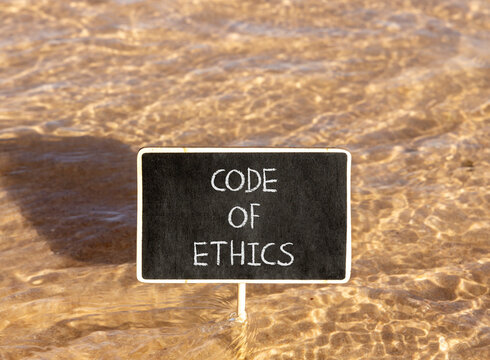 Code of ethics words symbol. Concept words Code of ethics on beautiful black blackboard. Beautiful sea water background. Business Code of ethics concept. Copy space.