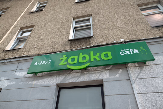 Krakow, Poland - July 19, 2026: Entrance to a Żabka Caf&eacute; convenience store in Poland.