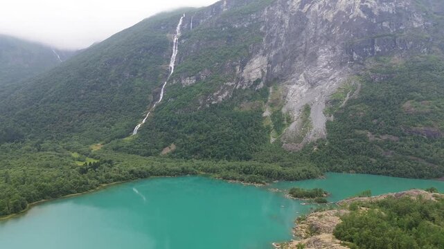 Cinematic Drone Revealing Lovatnet Lake and Ramnefjellet in Loen, Norway