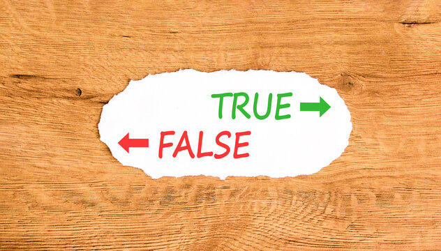 True or false symbol. Concept word True or False on beautiful white paper. Beautiful wooden background. Business and true or false concept. Copy space.