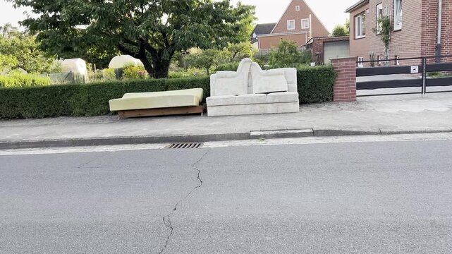 Discarded Sofa Sections Awaiting Sperrm&uuml;ll Pickup in German Neighborhood