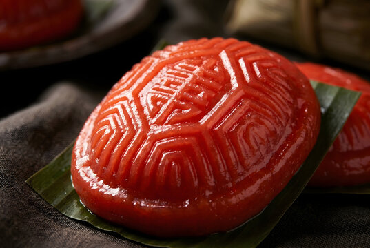 Glossy Ang Ku Kueh with detailed tortoise shell pattern and rich texture