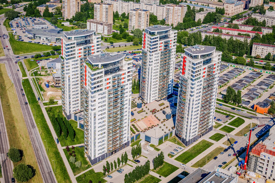 Riga, Latvia - 25 May 2014: Aerial view of modern residential district Skanste with high-rise apartment buildings, green spaces, and surrounding urban infrastructure.