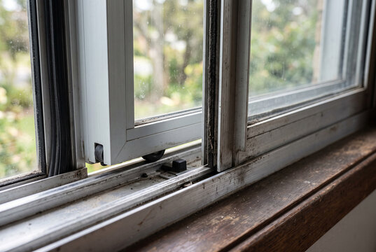 Close up of sliding window track and mechanism detail
