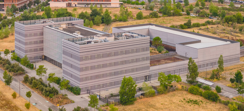 Alixan, France - 25 July 2026: Aerial view of the Ecotox scientific campus in the Rovaltain technology park, featuring modern architecture with horizontal facade stripes and surrounding greenery.