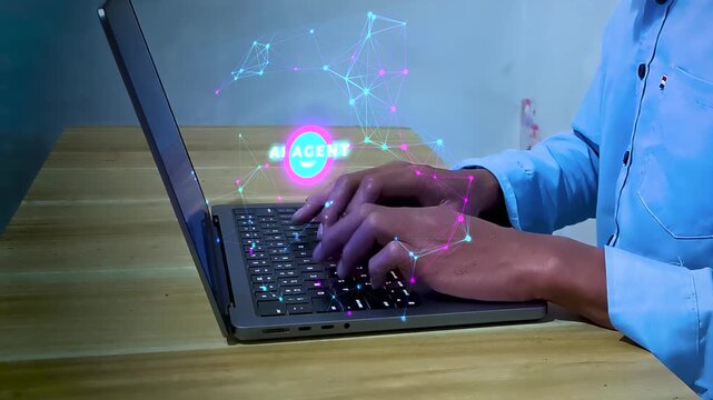 Hand typing on laptop with holographic AI agent icon and neon network node connectivity concept for intelligent automation, workflow management, task processing, and autonomous digital solution.