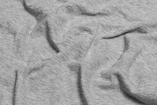 Crumpled light gray heather cotton fabric