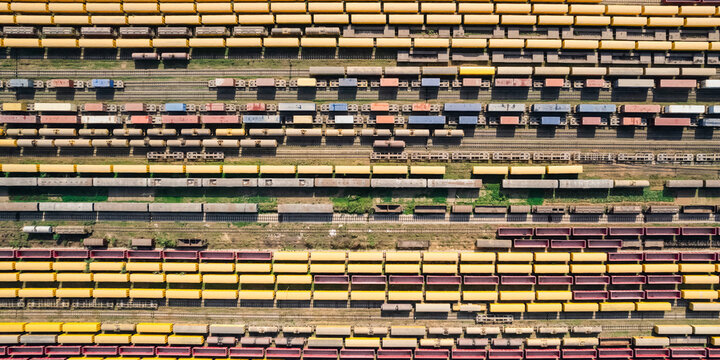 Chattogram, Chittagong Division, Bangladesh - 26 February 2025: Aerial view of the Rail Yard with rows of colorful freight train cars on parallel tracks in an industrial setting.