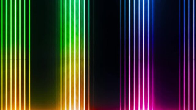 Colorful vertical laser columns glowing with rainbow neon light on black.