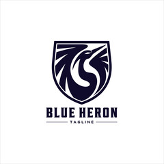 Obraz premium An Emblem or Badge Style Blue Heron Bird Spreading Wings Logo Design Illustration