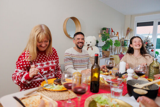 Family enjoying christmas holiday meal and joyful gathering
