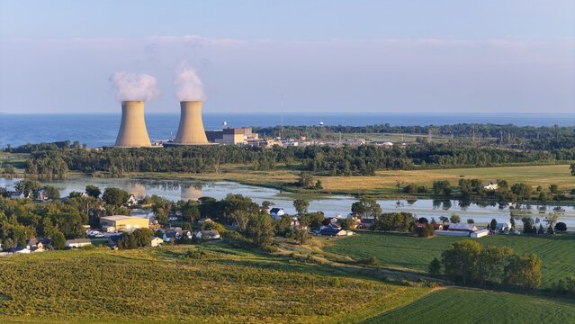 Frenchtown Township, Michigan, United States - 24 July 2026: Aerial view of the Enrico Fermi II Nuclear Power Plant with cooling towers emitting steam, located along the Lake Erie shoreline.