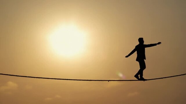Tightrope walker at sunset.