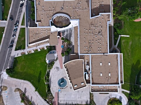 Boulder, United States - 23 July 2026: Aerial view of Casey Middle School showing the school building, rooftops, surrounding green lawns, and parking areas.