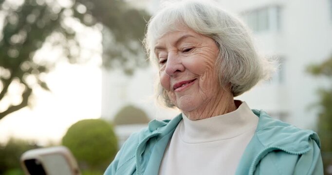 Text, smile and old woman outdoor with phone, online communication and post reaction on social media. Digital, happy and senior person with laugh, message update and chatting on virtual platform.