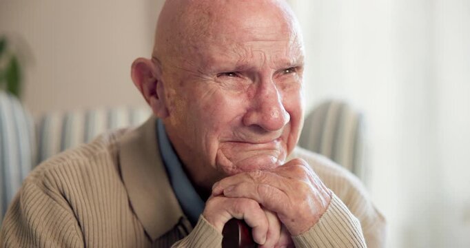 Senior, thinking or sad man with memory, loss or grief for past moment or nostalgia in home. Elderly, male person or crying with cane or walking stick for loneliness, widow or regret in old age house