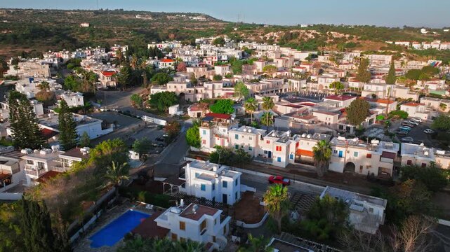 Aerial view of Protaras, Cyprus near Profitis Elias Church. Town buildings, roads and coastal scenery surround the famous hilltop landmark.