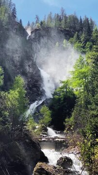 Stunning Osttirol mountain scenery with Umbalf&auml;lle waterfalls in springtime, East Tyrol, Austria