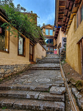Old Chinese Town Street Featuring Stone Pathway and Wooden Architecture