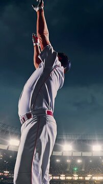 Baseball batter mid-swing at night stadium under floodlights
