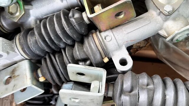 Close-up of automotive rubber bellows and metal mechanical parts