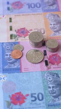 Malaysian ringgit banknotes as a tool for trade and financial transactions. The Malaysian ringgit as a background for your design