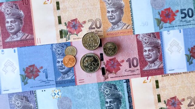 Malaysian ringgit banknotes as a tool for trade and financial transactions. The Malaysian ringgit as a background for your design