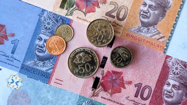 Malaysian ringgit banknotes as a tool for trade and financial transactions. The Malaysian ringgit as a background for your design