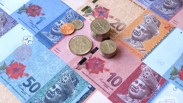 Malaysian ringgit banknotes as a tool for trade and financial transactions. The Malaysian ringgit as a background for your design