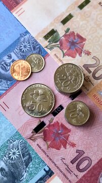 Malaysian ringgit banknotes as a tool for trade and financial transactions. The Malaysian ringgit as a background for your design