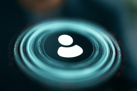 Glowing user login icon in a blue-green circle with digital effects on a dark background, representing online identity and security.