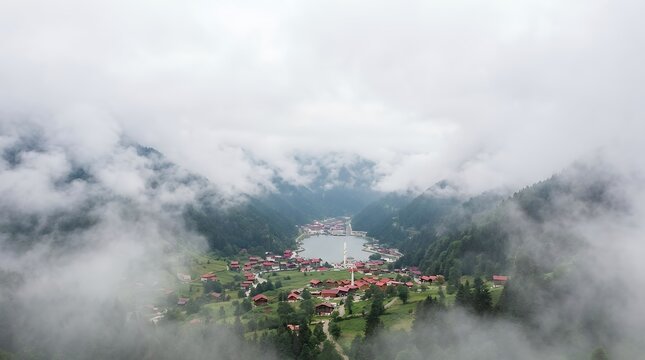 A breathtaking aerial view of Trabzon Uzungol showing Uzungol houses and lake with unique view through the clouds for nature and travel community concepts 3D render trabzon uzungol aerial view