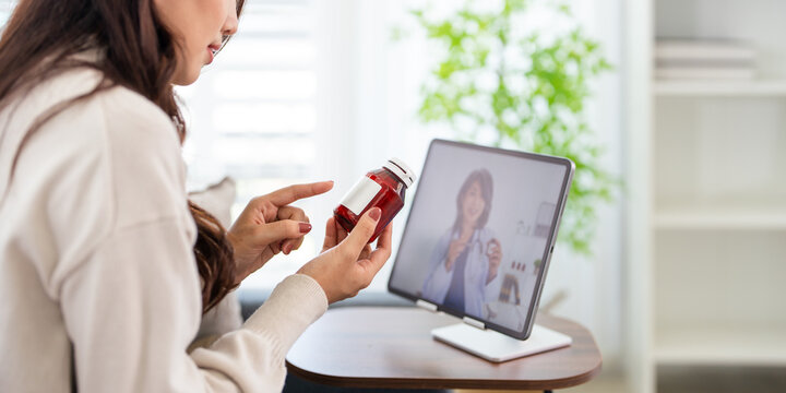 Patient woman at home on medical consultation via video call.  Telemedicine concept.
