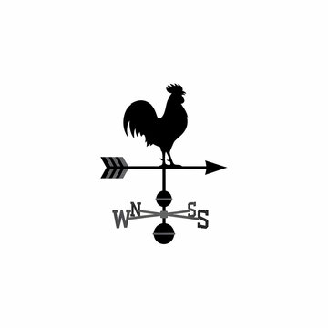 Classic weather vane featuring a rooster silhouette mounted on a rotating arrow indicating cardinal compass directions for monitoring wind flow and atmospheric pressure changes on rural farm