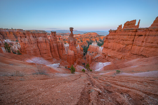 View of Thor's Hammer hoodoo surrounded by iconic red rock formations and desert landscape in Bryce Canyon National Park, Utah, United States.